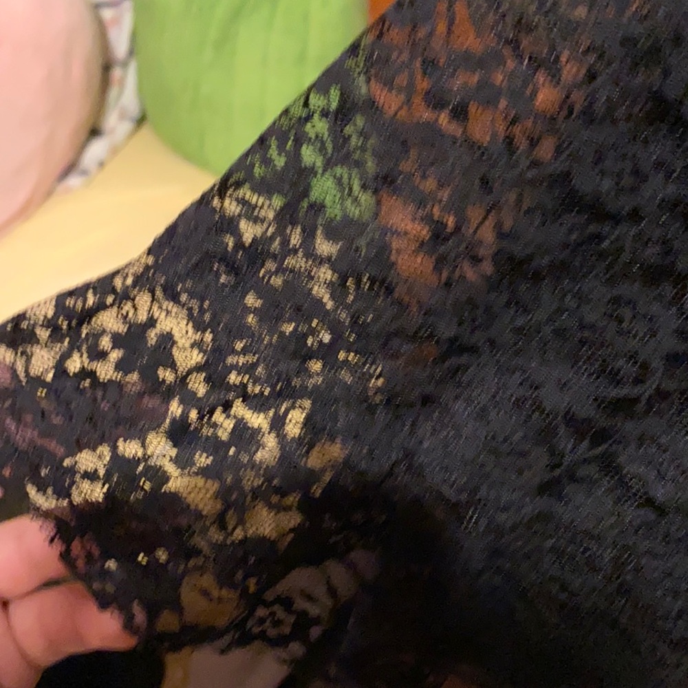 super cute black skirt with multiple colors and patterns.